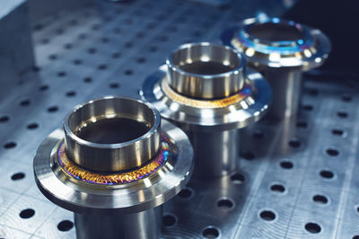 New freshly welded stainless steel flanges. demonstration of reference multi-colored seams