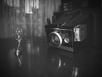 Close-up of camera on table