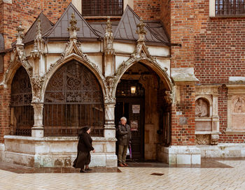 People standing in front of building