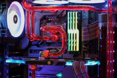 Close-up of illuminated machine at night