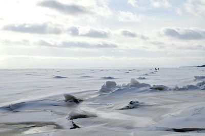 Scenic view of frozen landscape against sky