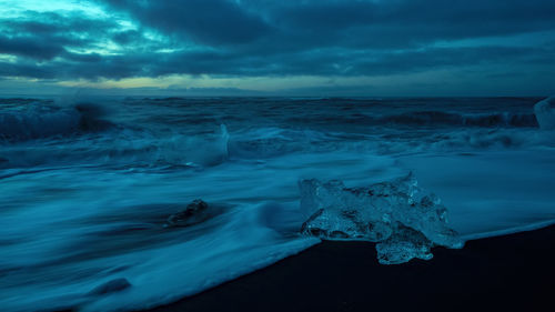 Aerial view of frozen sea against sky