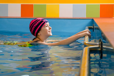 Girl swimming in pool