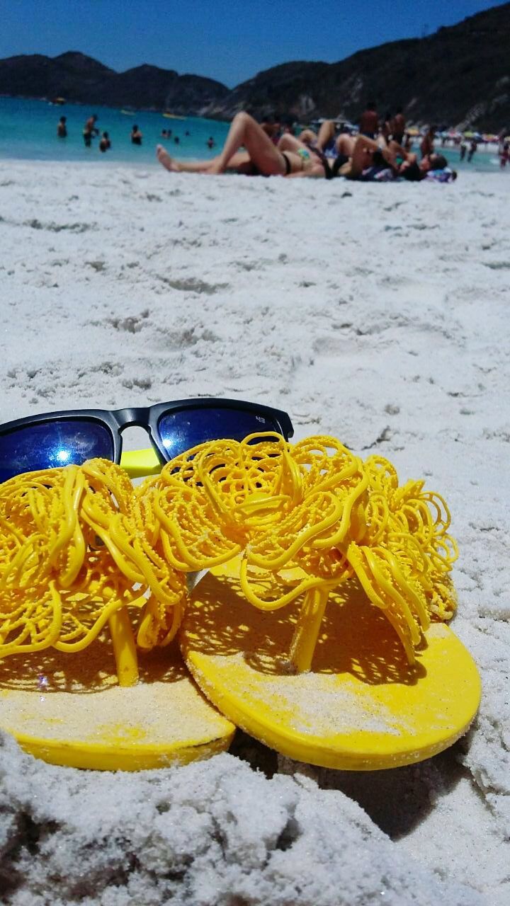 yellow, water, sea, beach, blue, sand, day, sunlight, outdoors, wood - material, nature, shore, tranquility, no people, close-up, incidental people, beauty in nature, nautical vessel, transportation, rusty