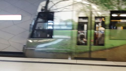 Blurred motion of train at railroad station platform