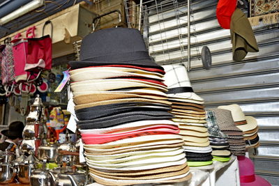 Stack of clothes hanging in store for sale