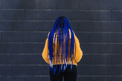 Rear view of woman walking on staircase