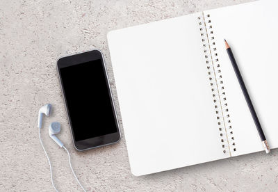 High angle view of smart phone on table