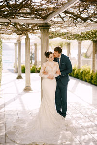 Rear view of couple standing in park