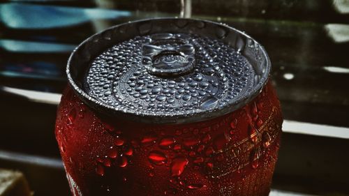 Close-up of water drops on red wine