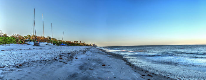 Scenic view of sea against clear sky during sunset