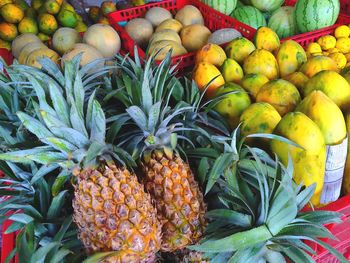 Close-up of pineapples for sale at market stall
