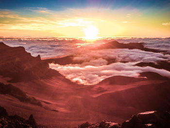 Scenic view of dramatic sky during sunset