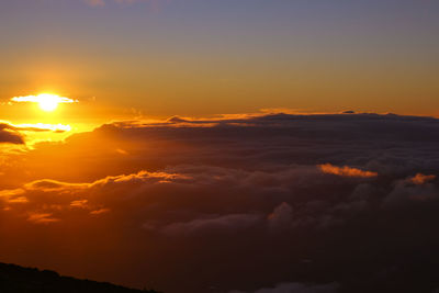 Low angle view of dramatic sky during sunset