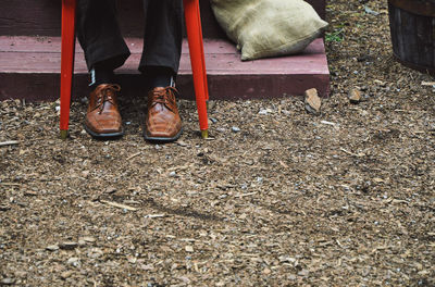 Low section of man standing on floor