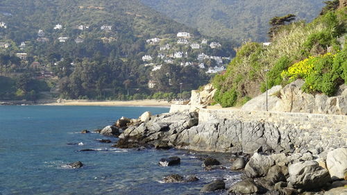 Scenic view of sea against mountains