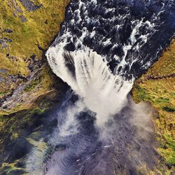 Water splashing on rock formation