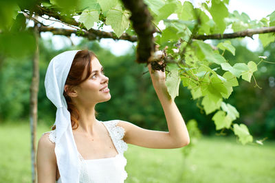 Young woman holding flower