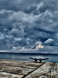 Scenic view of sea against cloudy sky