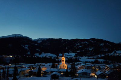 Scenic view of snowcapped mountains against clear blue sky