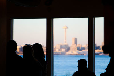 Silhouette of people standing in city