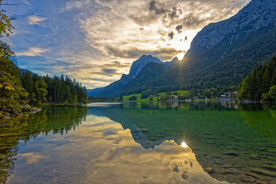 Scenic view of lake and mountains against sky