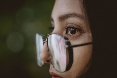 Close-up of woman wearing eyeglasses 