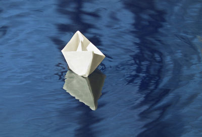 High angle view of paper boat floating on water