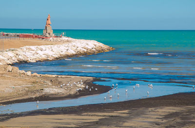 Scenic view of beach against sky