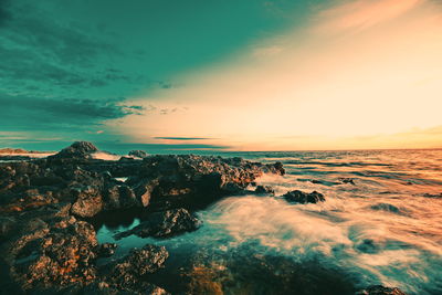 Scenic view of sea against sky during sunset