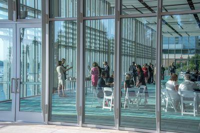 Group of people in glass building