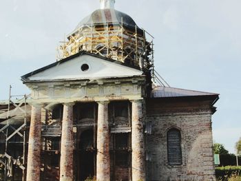 Low angle view of old building against sky