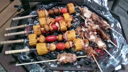 High angle view of meat on barbecue grill