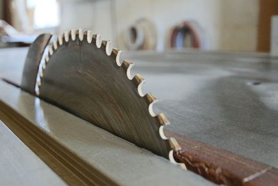 Close-up of metallic equipment on table