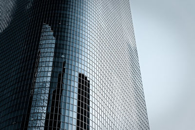 Low angle view of skyscraper against sky