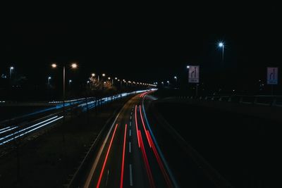 Light trails on road in city at night