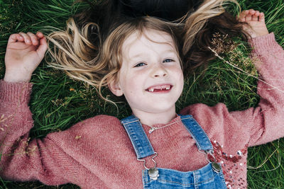 Portrait of a smiling woman lying down