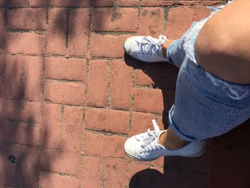 Low section of man standing on ground