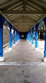 Empty road with bridge in background