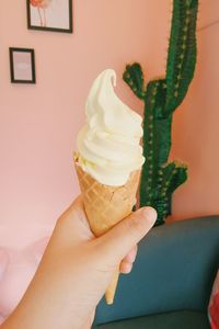 Hand holding ice cream cone