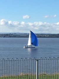 Sailboat in calm blue sea