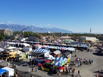 High angle view of people at beach against blue sky