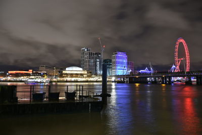 Illuminated buildings in city at night