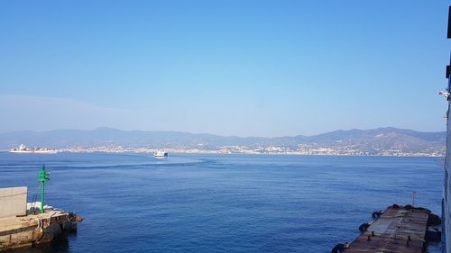 Scenic view of sea against clear blue sky