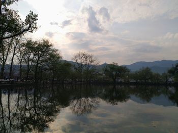 Scenic view of lake against sky during sunset