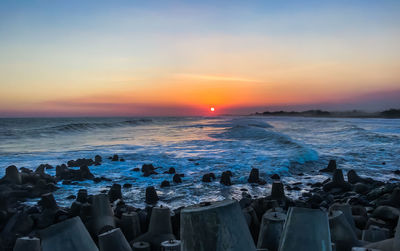 Scenic view of sea against sky during sunset