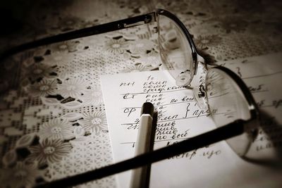 High angle view of text on glass
