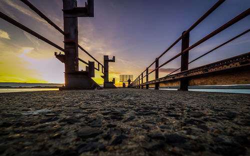 View of bridge in city at sunset