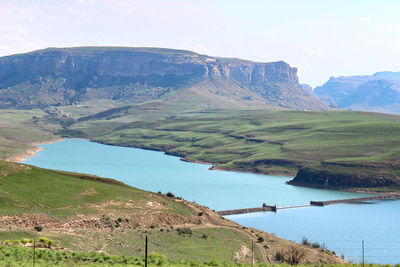 Scenic view of landscape and mountains against sky