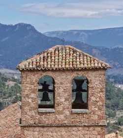 Old building against cloudy sky